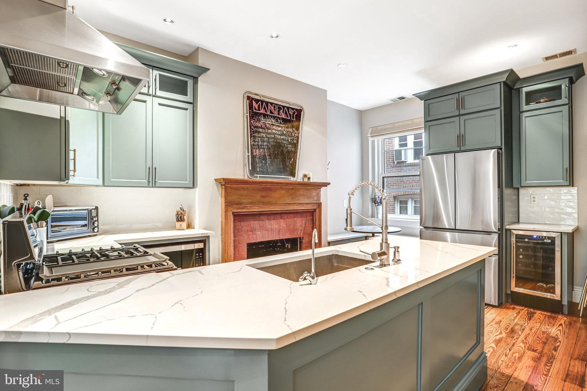 1820 Kalorama Road Northwest, Unit 3 Washington, DC 20009 - Photo 10 of 32 a kitchen with a refrigerator and a sink