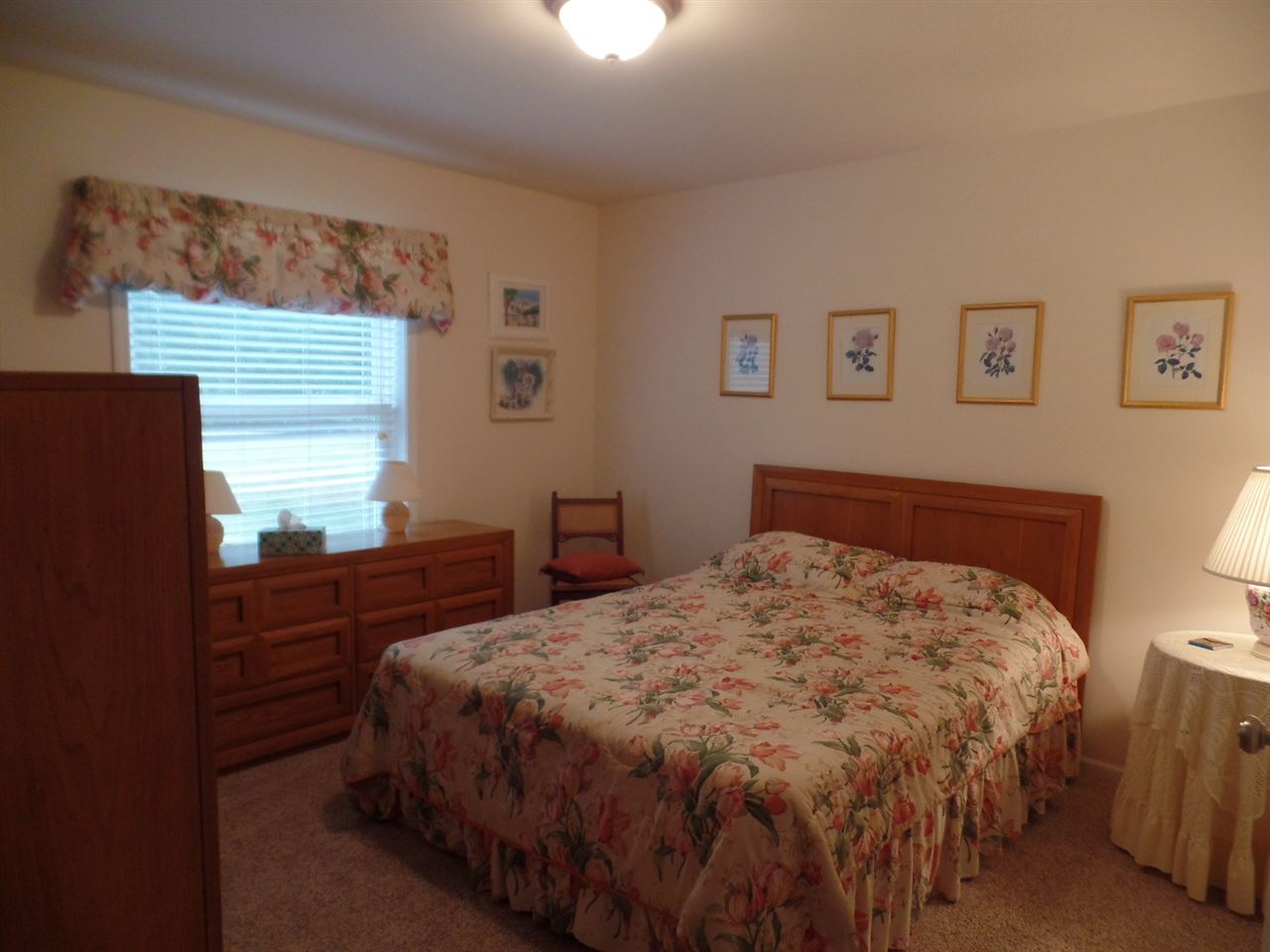 419 Elizabeth Road Oregon, IL 61061 - Photo 11 of 13 a bedroom with a bed and wooden floor