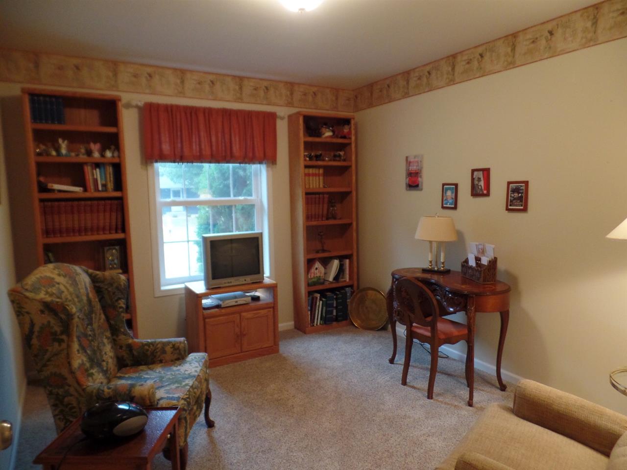 419 Elizabeth Road Oregon, IL 61061 - Photo 9 of 13 a living room with furniture and a flat screen tv