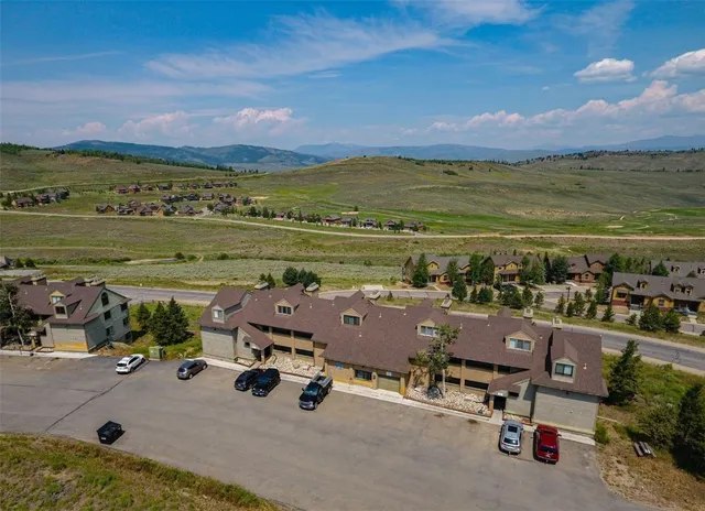 a view of a lake with a house in the background