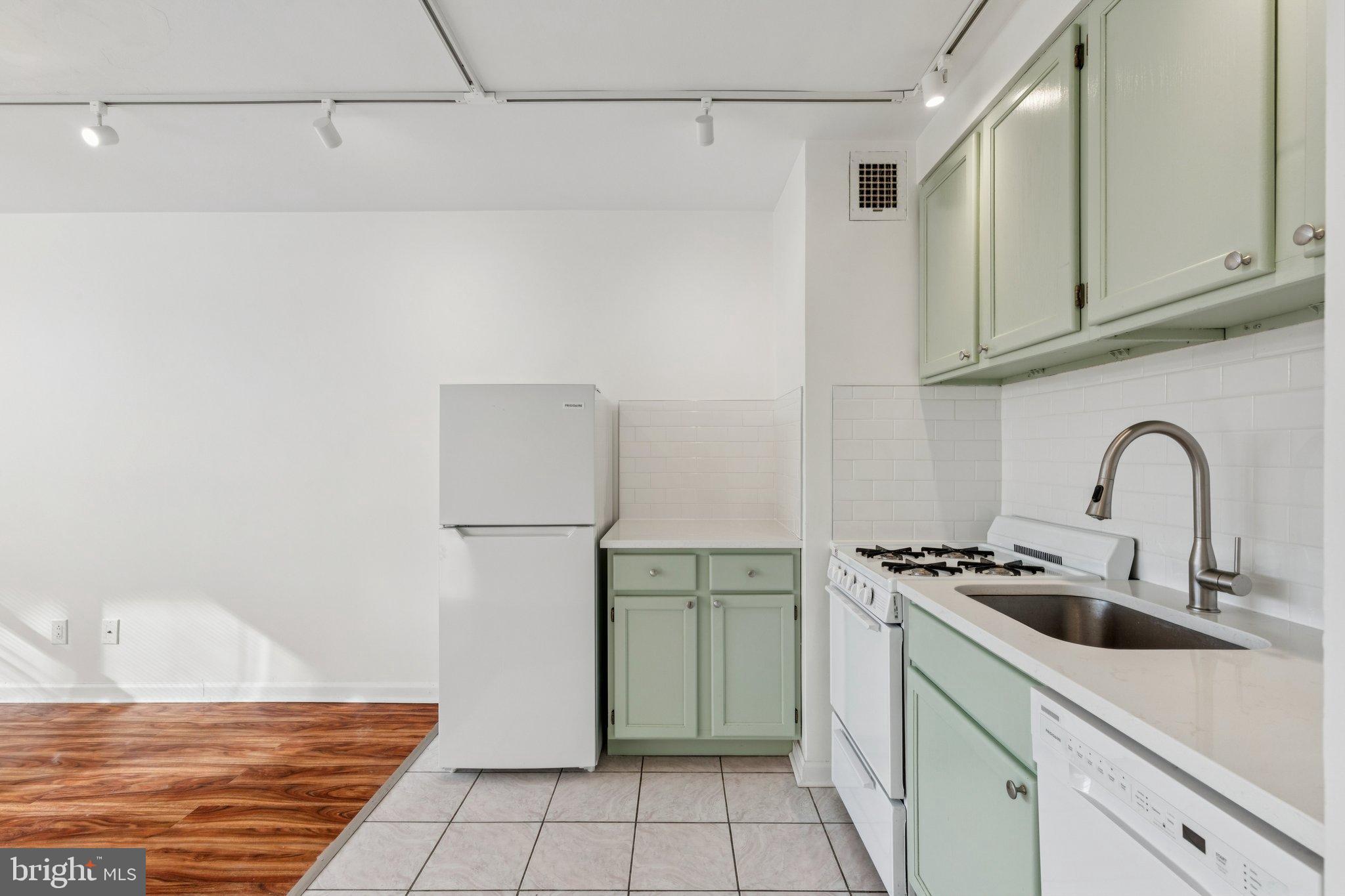 1810 Rittenhouse Square, Unit 406 Philadelphia, PA 19103 - Photo 7 of 17 Charming kitchen with mint green accents.