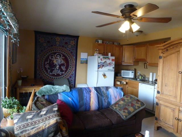 150 Evergreen Road, Unit 205 Dillon, CO 80435 - Photo 6 of 18 a living room with furniture and a chandelier