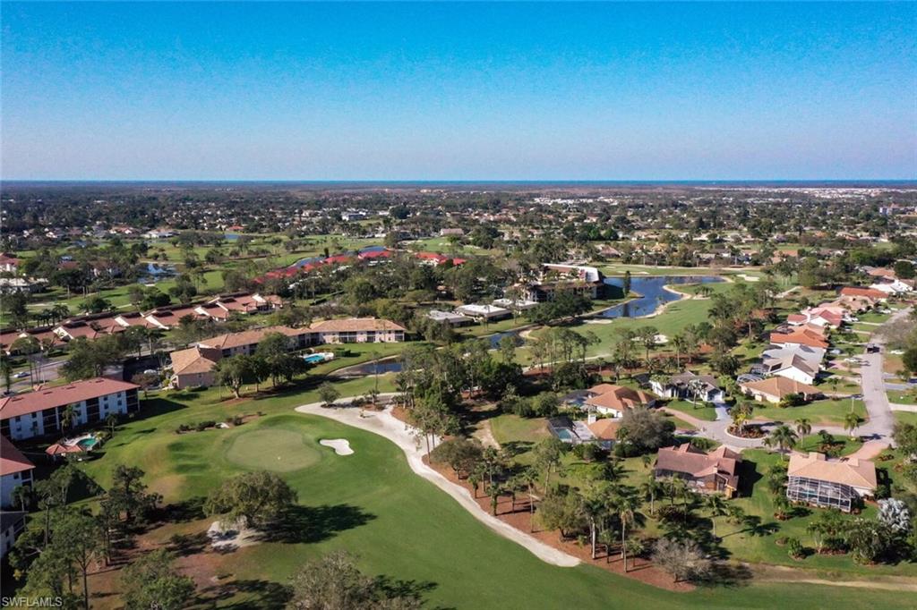 565 Augusta Boulevard, Unit 24 Naples, FL 34113 - Photo 1 of 26 an aerial view of residential houses with outdoor space