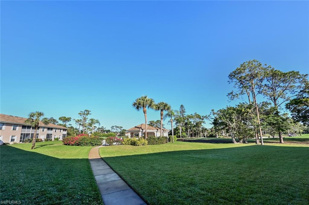 565 Augusta Boulevard, Unit 24 Naples, FL 34113 - Photo 11 of 26 a view of a green field