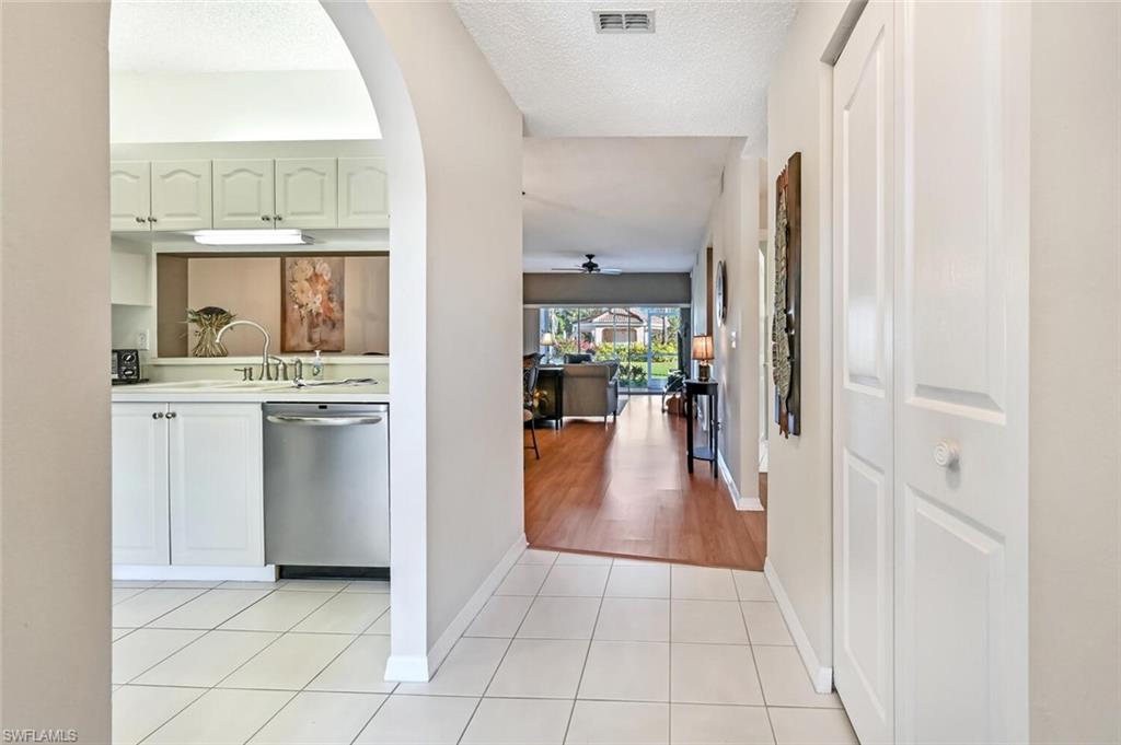 565 Augusta Boulevard, Unit 24 Naples, FL 34113 - Photo 16 of 26 a view of a kitchen with a sink and cabinets