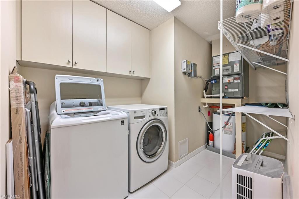 565 Augusta Boulevard, Unit 24 Naples, FL 34113 - Photo 21 of 26 a utility room with dryer and washer