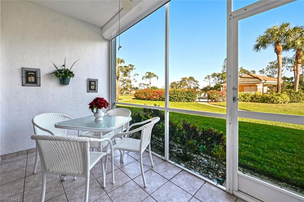 565 Augusta Boulevard, Unit 24 Naples, FL 34113 - Photo 25 of 26 a view of an outdoor dining space with furniture