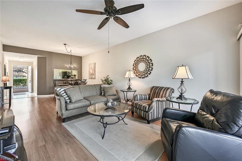 565 Augusta Boulevard, Unit 24 Naples, FL 34113 - Photo 6 of 26 a living room with furniture