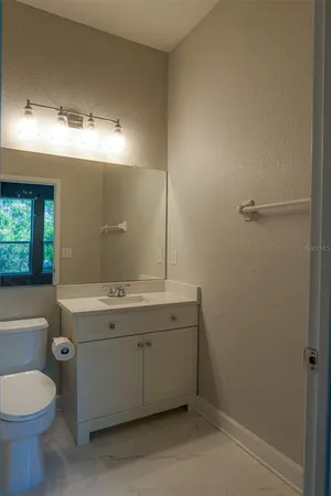 a bathroom with a sink and mirror