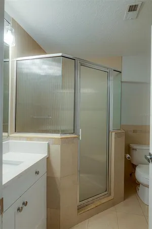 a bathroom with a shower and a toilet
