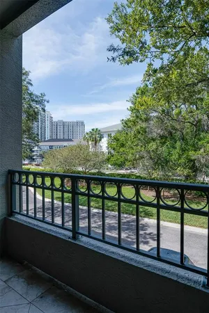 a view of a chairs and table in a balcony