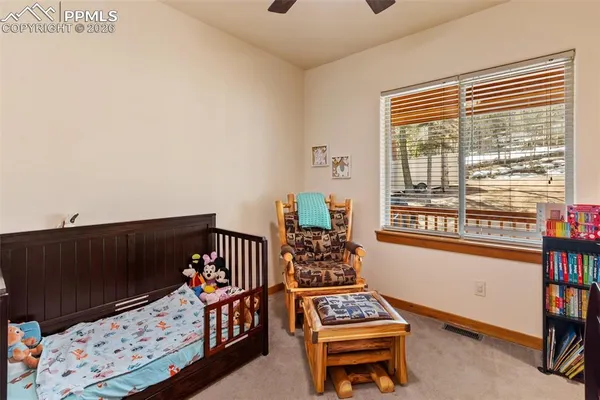 a bedroom with furniture and a window