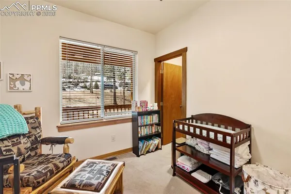 a bedroom with furniture and a window