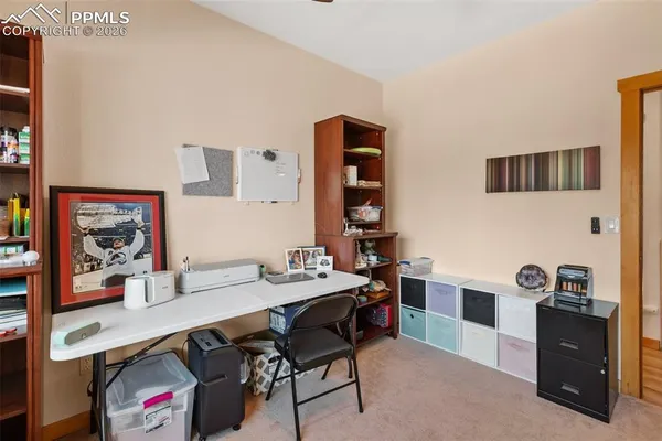 a view of a workspace with furniture