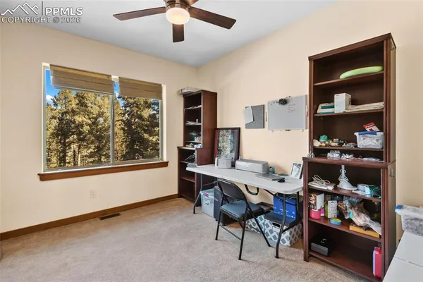 a workspace with furniture and window