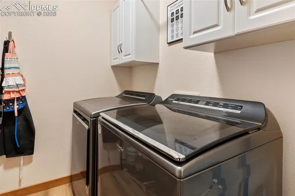 a close view of a sink and a stove in the kitchen
