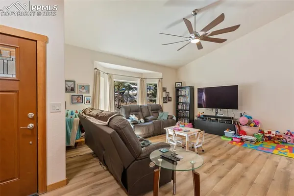 a living room with furniture and a flat screen tv