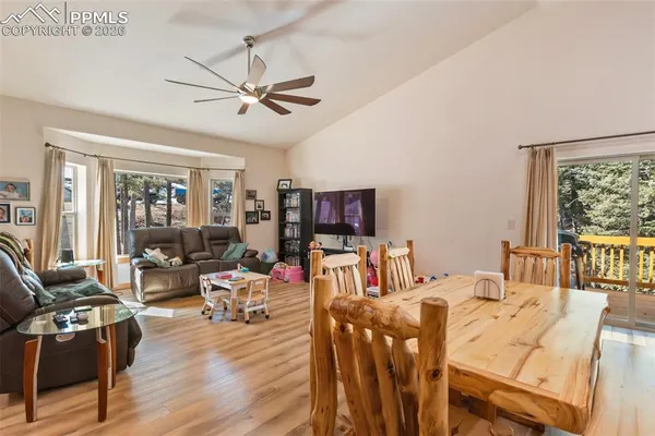 a view of a dining room with furniture window and outside view