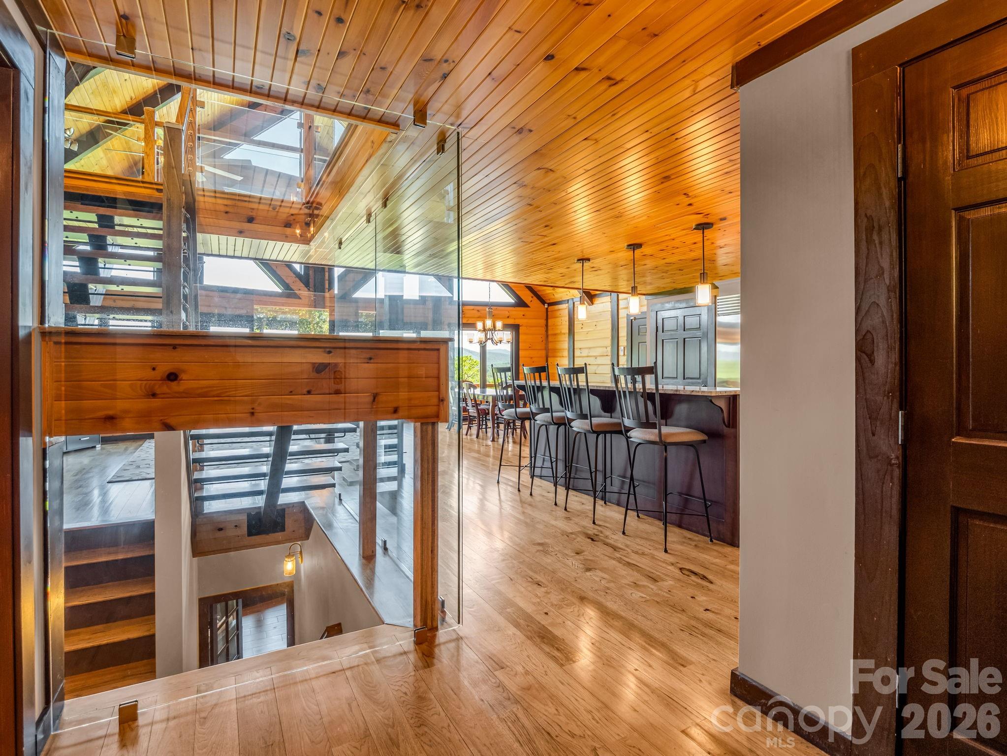 590 Boulder Ridge Lake Lure, NC 28746 - Photo 9 of 48 a view of a balcony with dining table and chairs