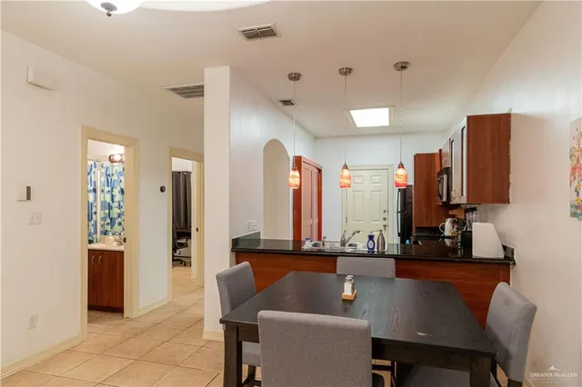 a view of dining room and kitchen with a table chairs