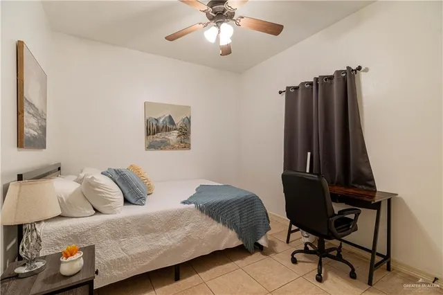 a bedroom with a bed and a chair