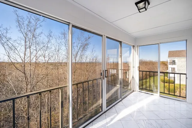 a view of an empty room with a balcony