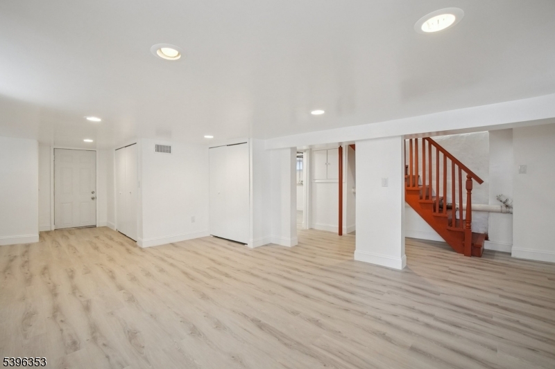19 Ashwood Avenue, Unit 1 Summit, NJ 07901 - Photo 15 of 17 a view of an empty room with wooden floor
