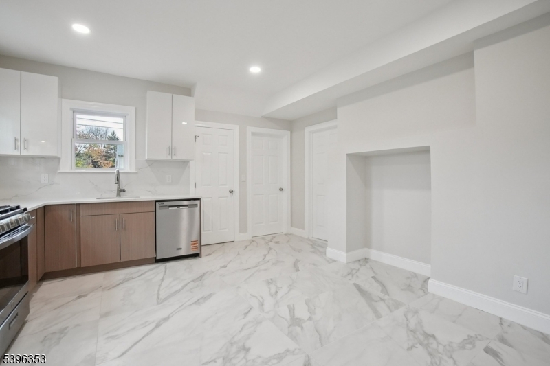 19 Ashwood Avenue, Unit 1 Summit, NJ 07901 - Photo 7 of 17 a view of a kitchen with a sink cabinets and wooden floor
