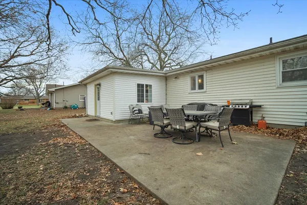 a view of a yard with a tree