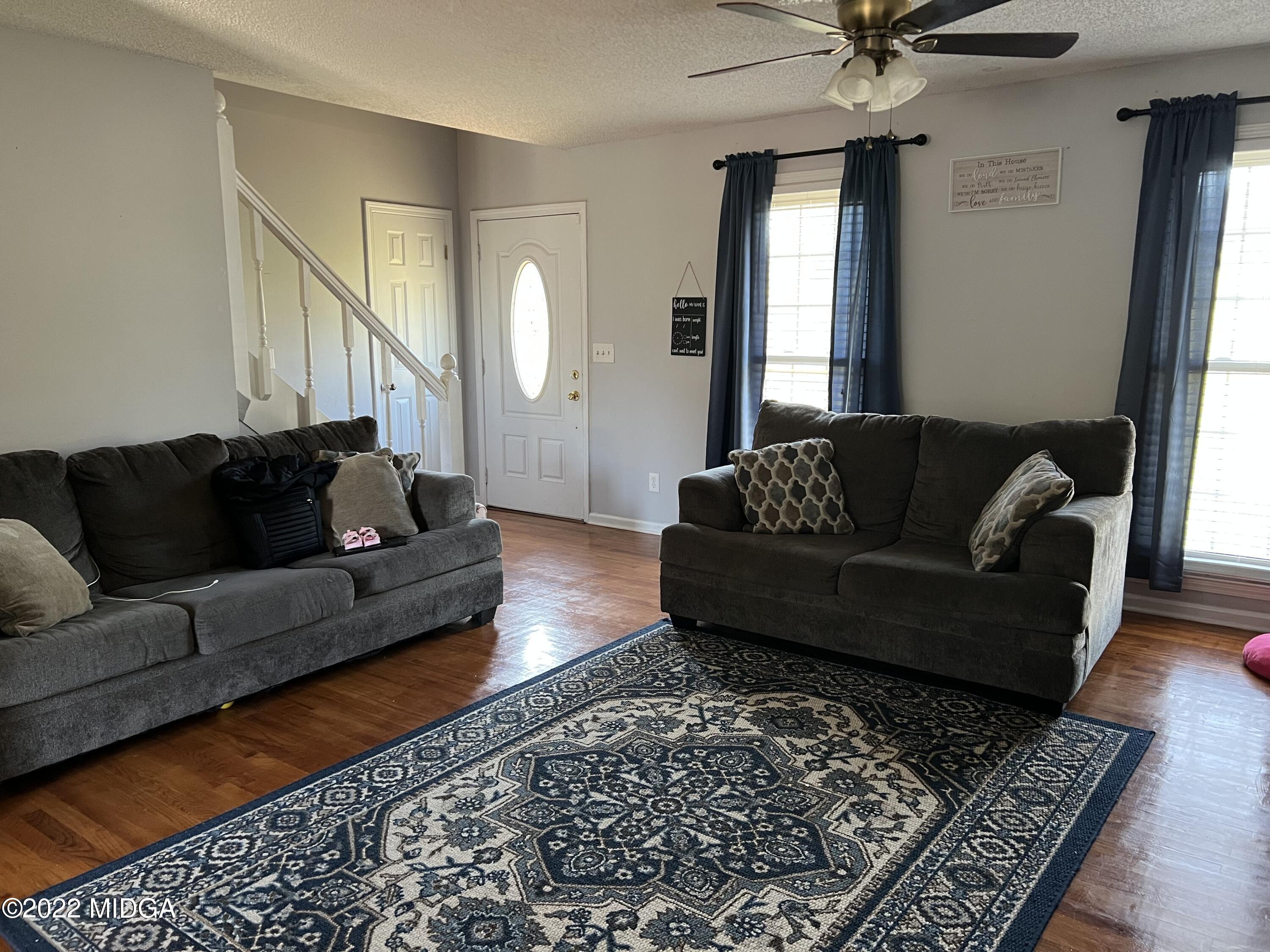 3821 Bobby Court Macon, GA 31216 - Photo 2 of 15 a living room with furniture and a rug