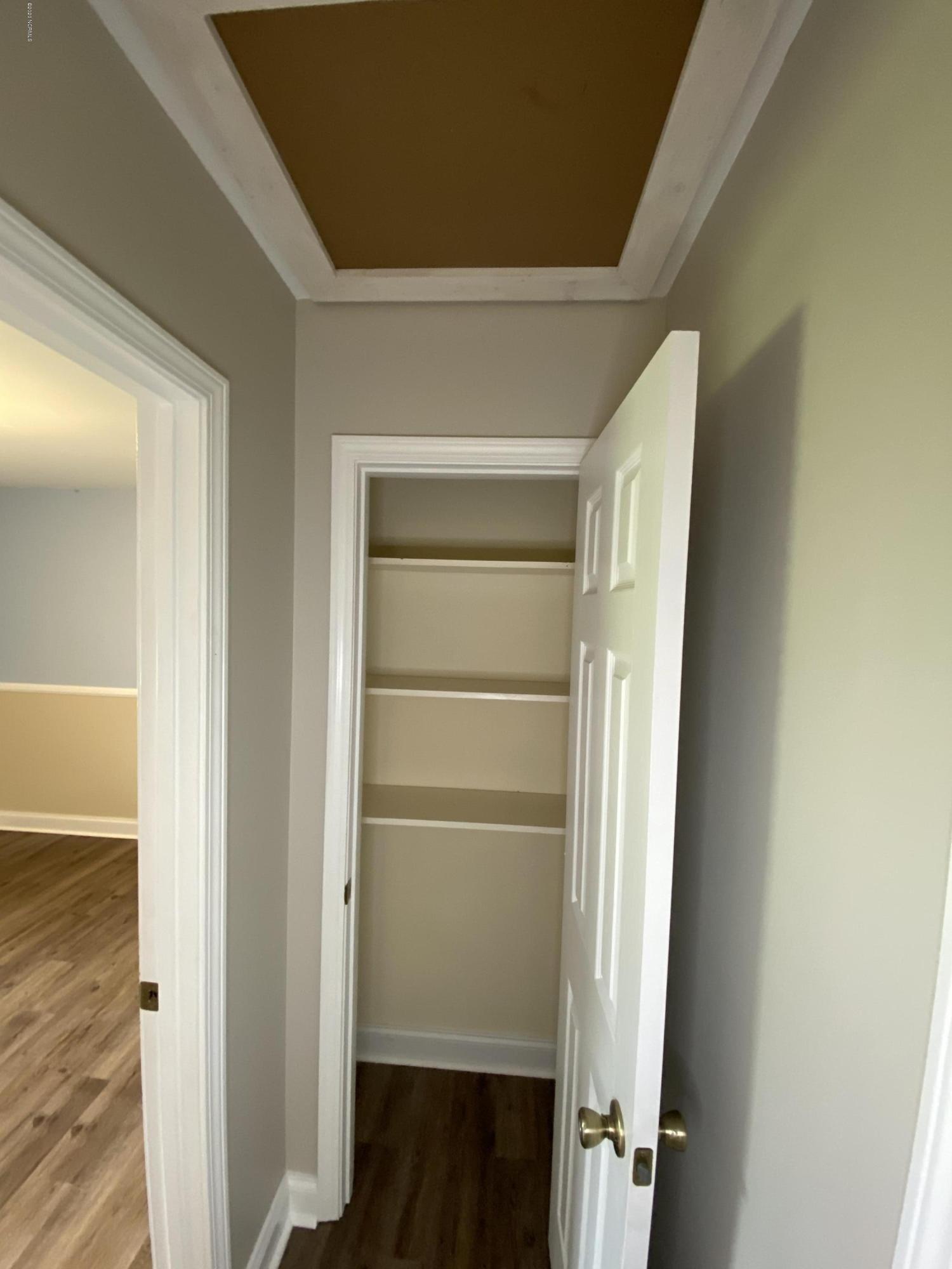 138 Bayberry Road Newport, NC 28570 - Photo 54 of 70 Linen closet at end of hallway and attic space above.