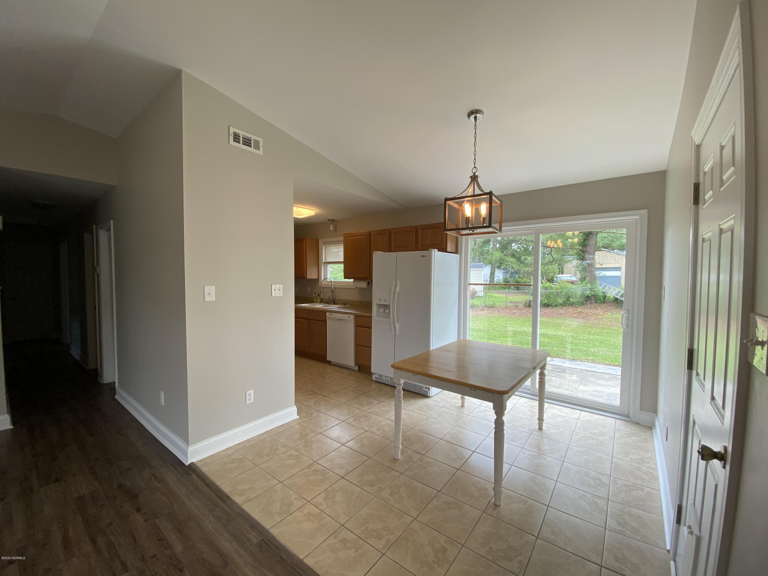 138 Bayberry Road Newport, NC 28570 - Photo 9 of 70 Living room opens up into dining area and kitchen.