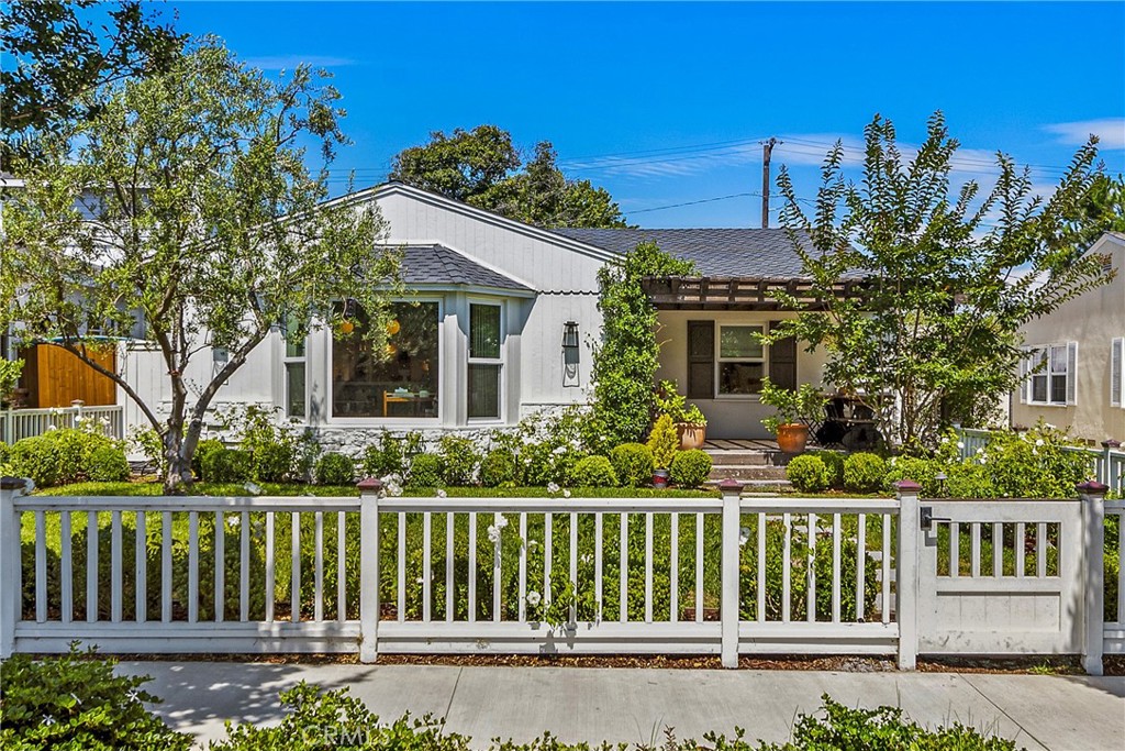 front view of a house with a garden