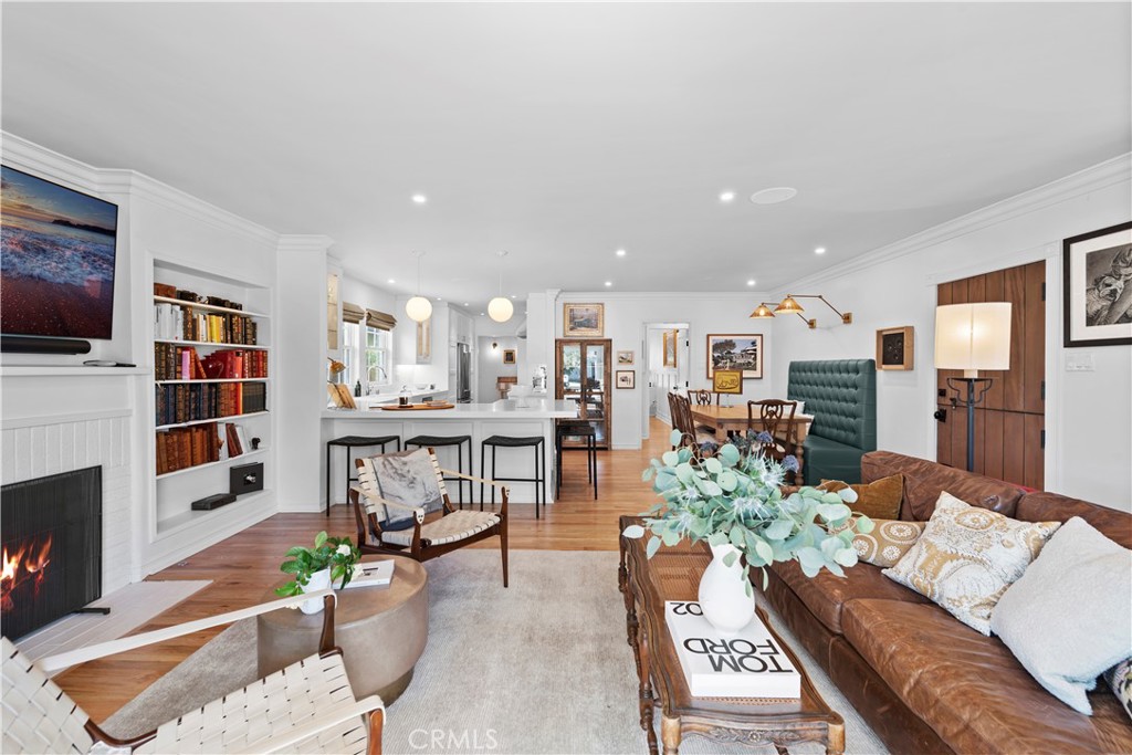 320 Broadway Costa Mesa, CA 92627 - Photo 11 of 43 a living room with furniture a flat screen tv and a fireplace