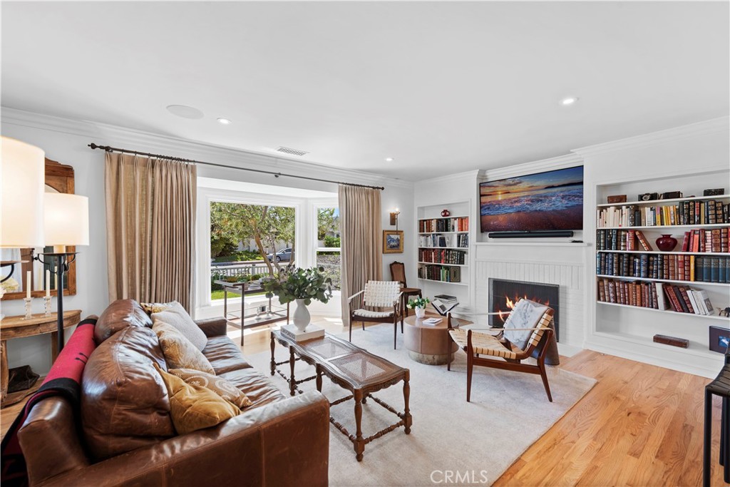 320 Broadway Costa Mesa, CA 92627 - Photo 13 of 43 a living room with furniture fireplace and a large window