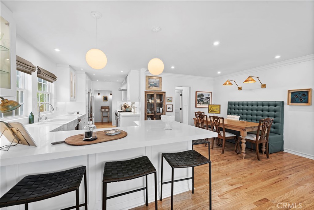 320 Broadway Costa Mesa, CA 92627 - Photo 17 of 43 a view of a dining room with furniture and wooden floor