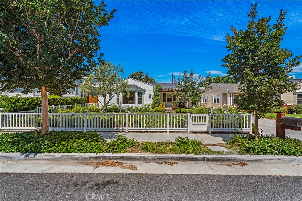 320 Broadway Costa Mesa, CA 92627 - Photo 3 of 43 a front view of a house with a garden