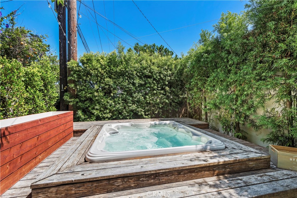 320 Broadway Costa Mesa, CA 92627 - Photo 31 of 43 a view of a wooden bench sitting in the middle of a yard