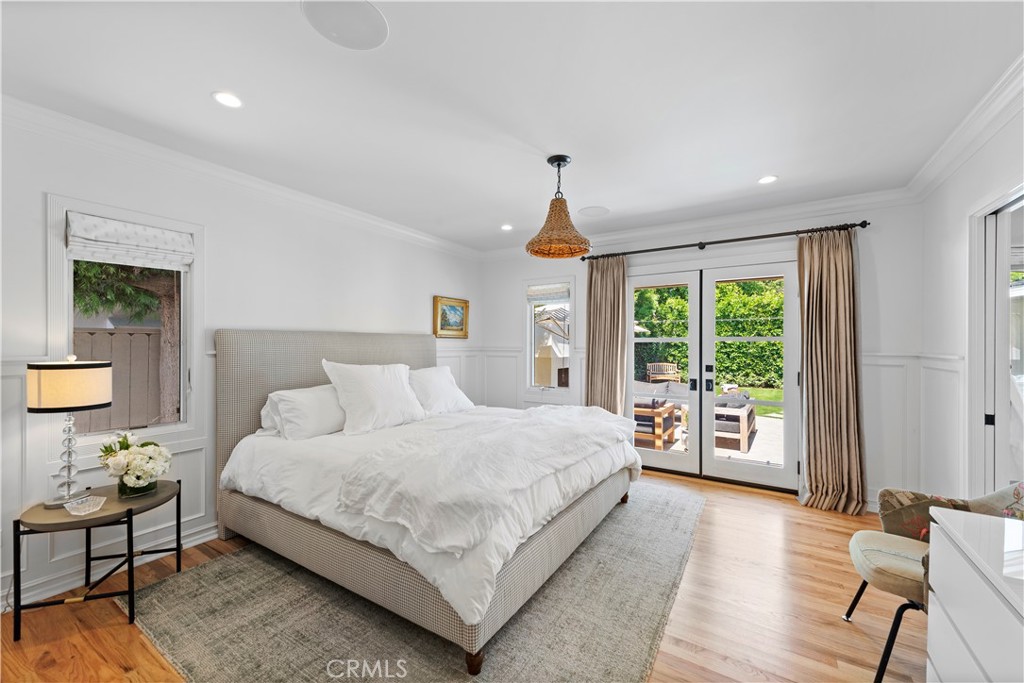 320 Broadway Costa Mesa, CA 92627 - Photo 33 of 43 a bedroom with a large bed and a large window