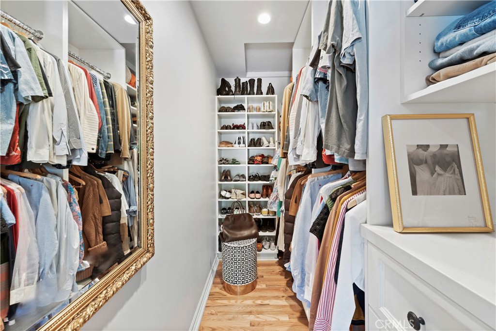 320 Broadway Costa Mesa, CA 92627 - Photo 37 of 43 a view of walk in closet with clothes and shoes