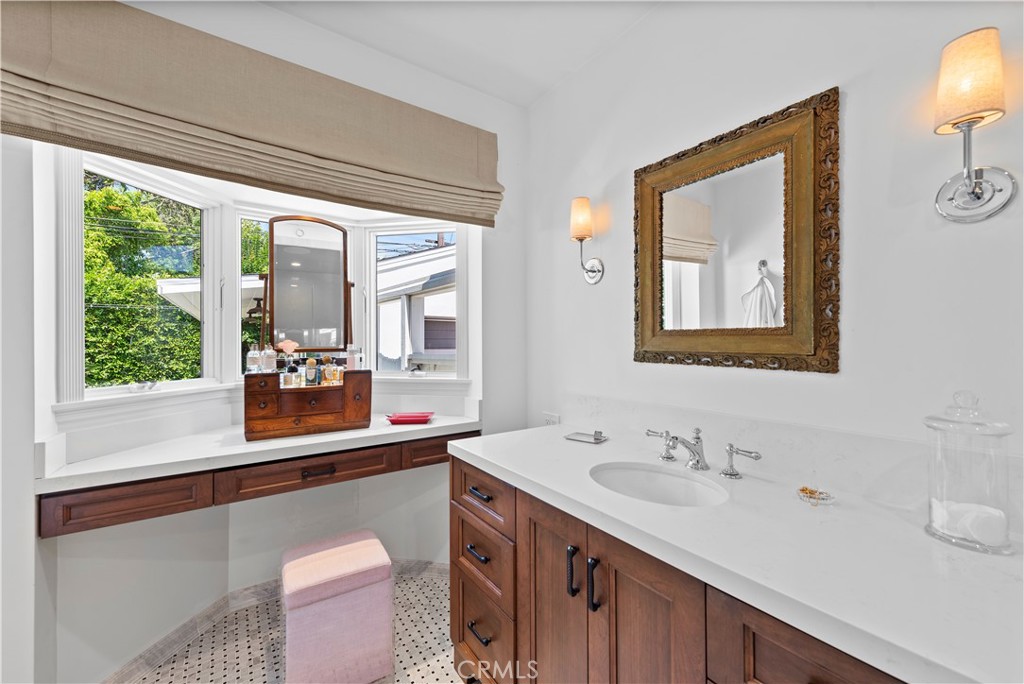320 Broadway Costa Mesa, CA 92627 - Photo 38 of 43 a en suite bathroom with a sink mirror and a window
