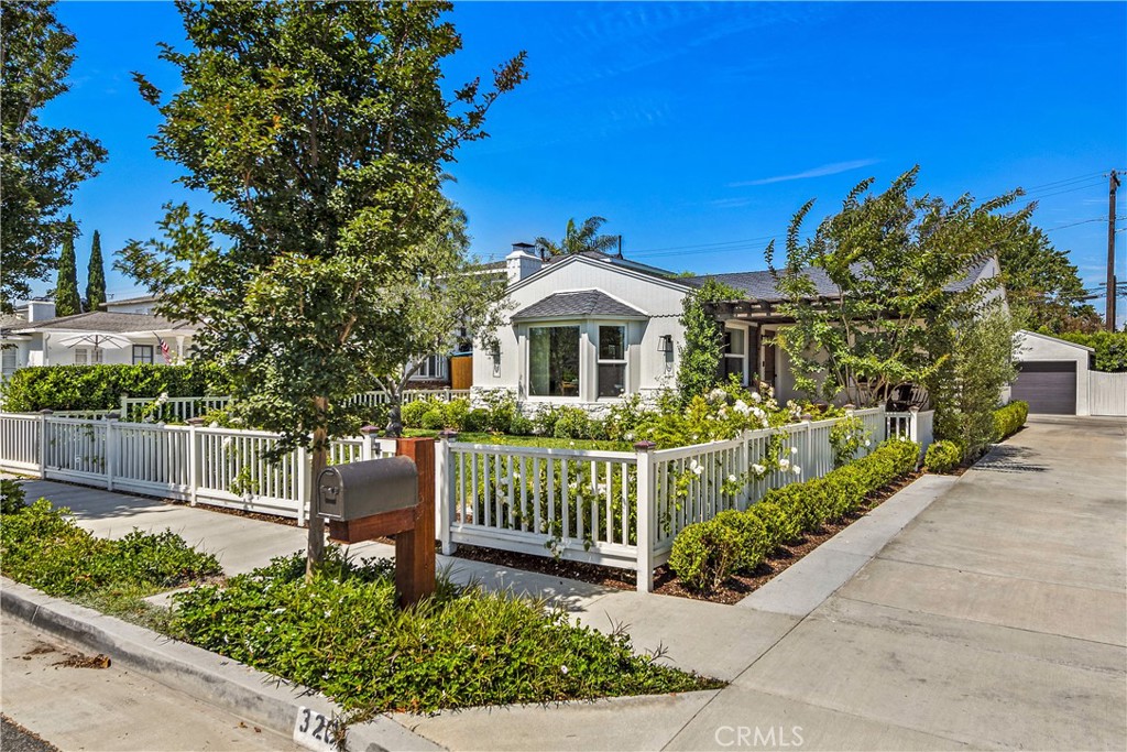 320 Broadway Costa Mesa, CA 92627 - Photo 7 of 43 a front view of a house with a garden