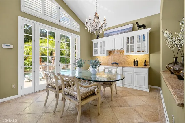 a spacious bathroom with a tub and a large window