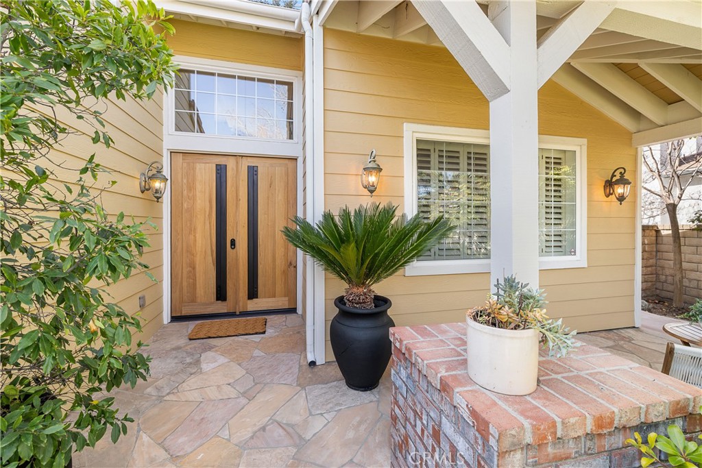 24587 Lola Lane Newhall, CA 91321 - Photo 43 of 44 a view of a flower pot with table and chair