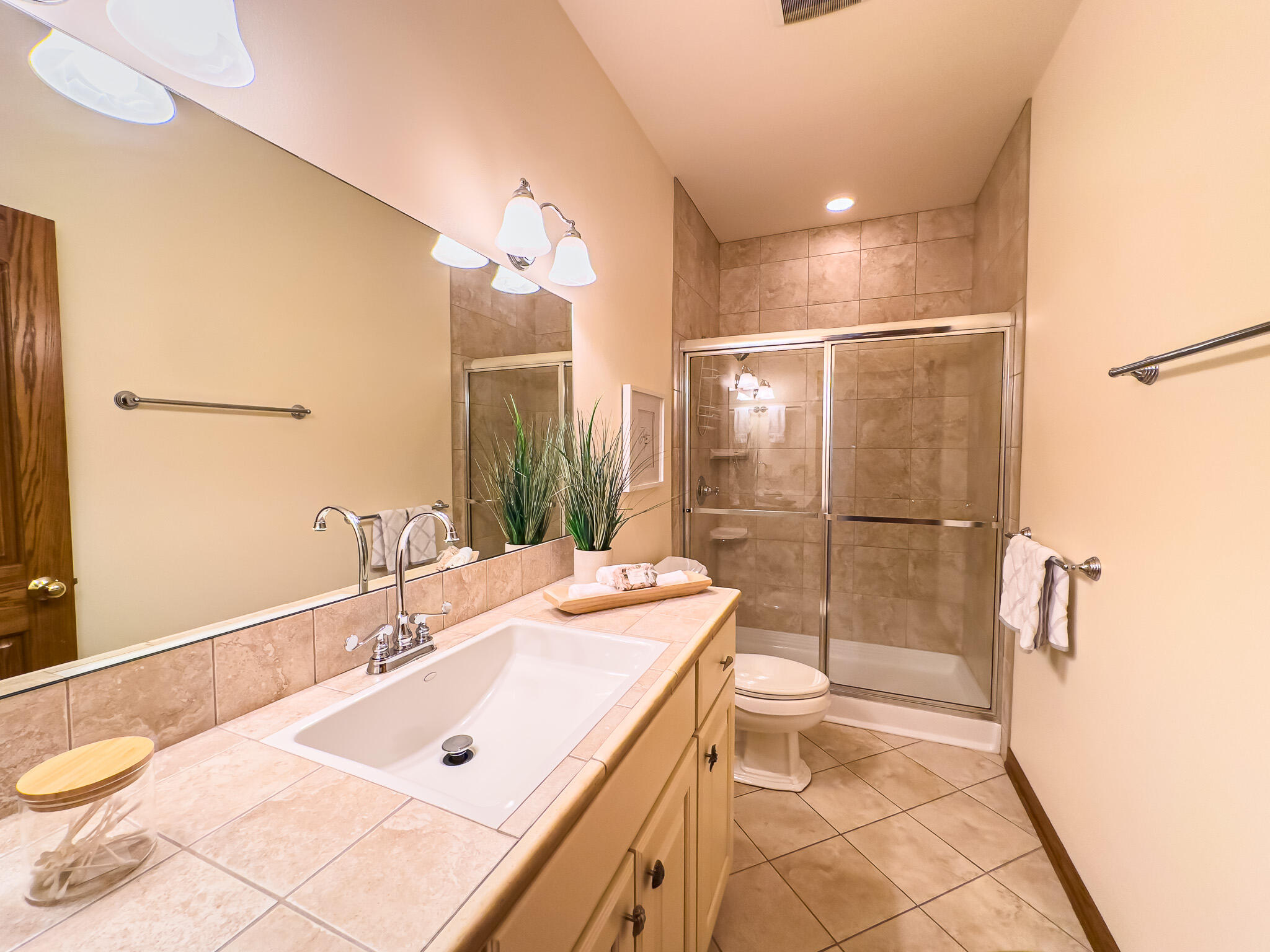 11604 North Granville Road Mequon, WI 53097 - Photo 32 of 49 Tiled floor, tiled shower area and lots of storage in the vanity.