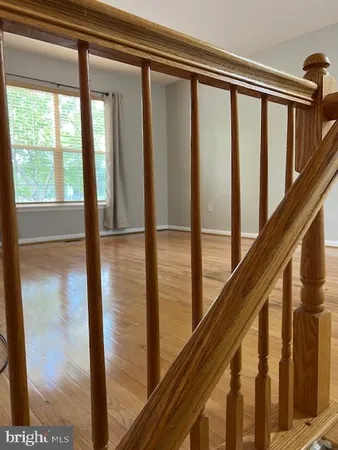 a view of staircase with railing and stairs