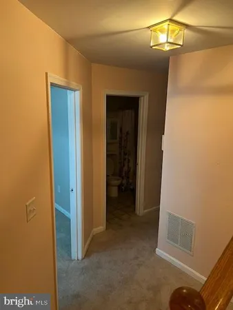 a view of a hallway with closet