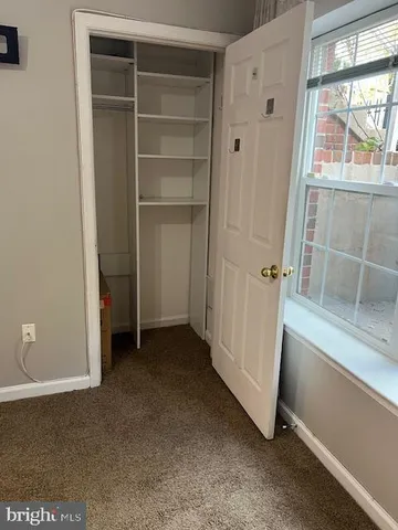 a bathroom with a toilet and a bathtub