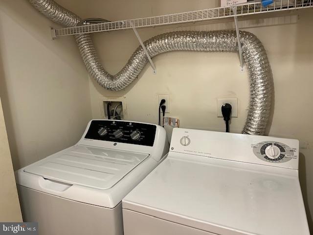 2066 University Boulevard West, Unit 7 Silver Spring, MD 20902 - Photo 37 of 37 a utility room with dryer and washer
