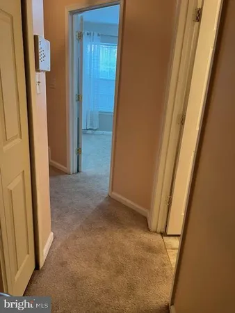 a view of hallway with a sink